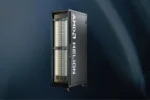 AMD Helion agentic AI rack with the AMD Helion logo on its side door against a dark blue background