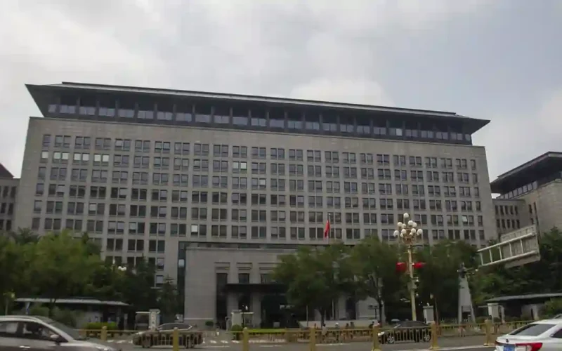 The Ministry of Commerce of the People's Republic of China headquarters building on Chang'an Avenue in Beijing under a cloudy sky