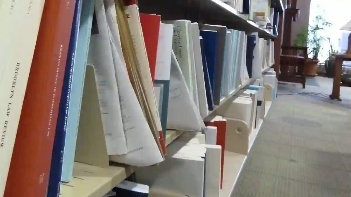 Law library shelf with Brooklyn Law Review volumes and visible gaps, an example scene from the Humanity's Sixth Sense benchmark