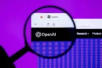 Magnifying glass over the OpenAI website logo on a purple background